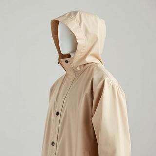 Coastal capsule raincoat by the shore