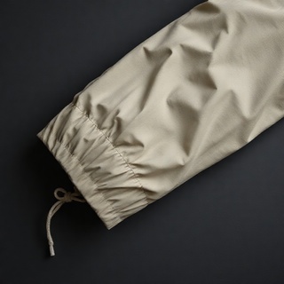 Raincoat folded into a breathable sleeve