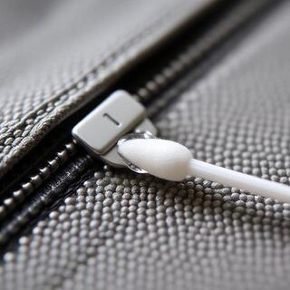 Applying zipper lubricant to keep teeth smooth