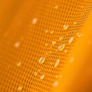 Saffron canopy fabric close-up with water beads