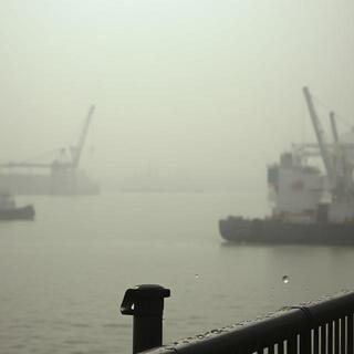 Vizag harbour cranes in mist and spray