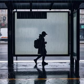 Bus shelter in rain with puddles
